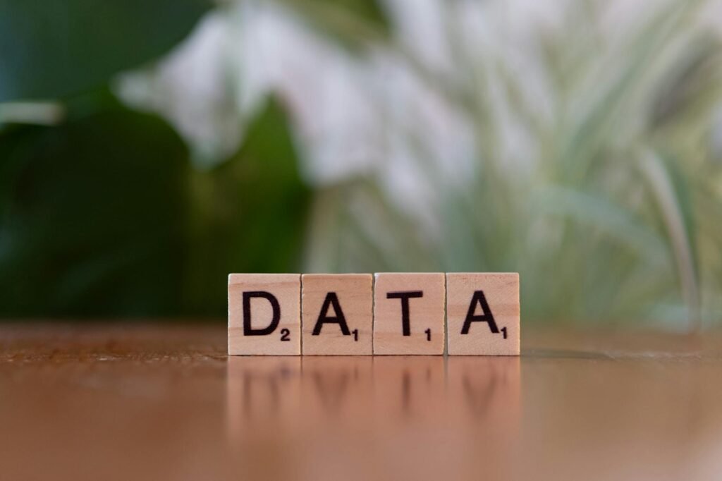 data scrabble tiles on wooden surface